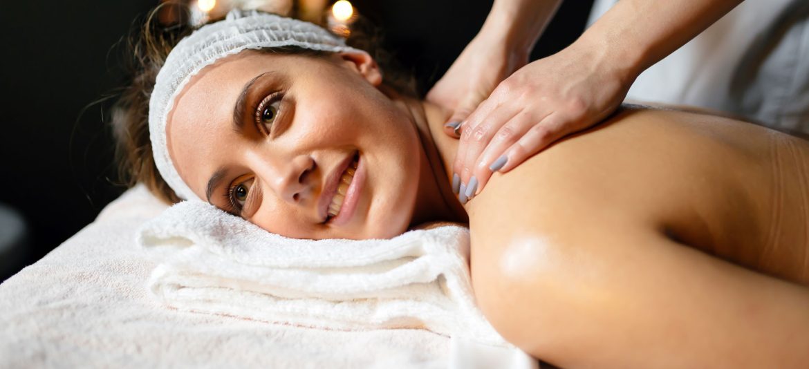 beautiful-young-and-cute-woman-enjoying-massage-UZ97GDC.jpg
